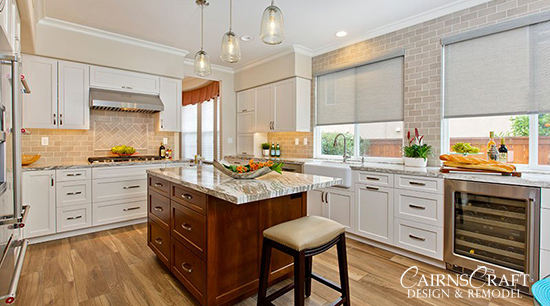 Whole Home Remodel - White cabinets and natural wood island