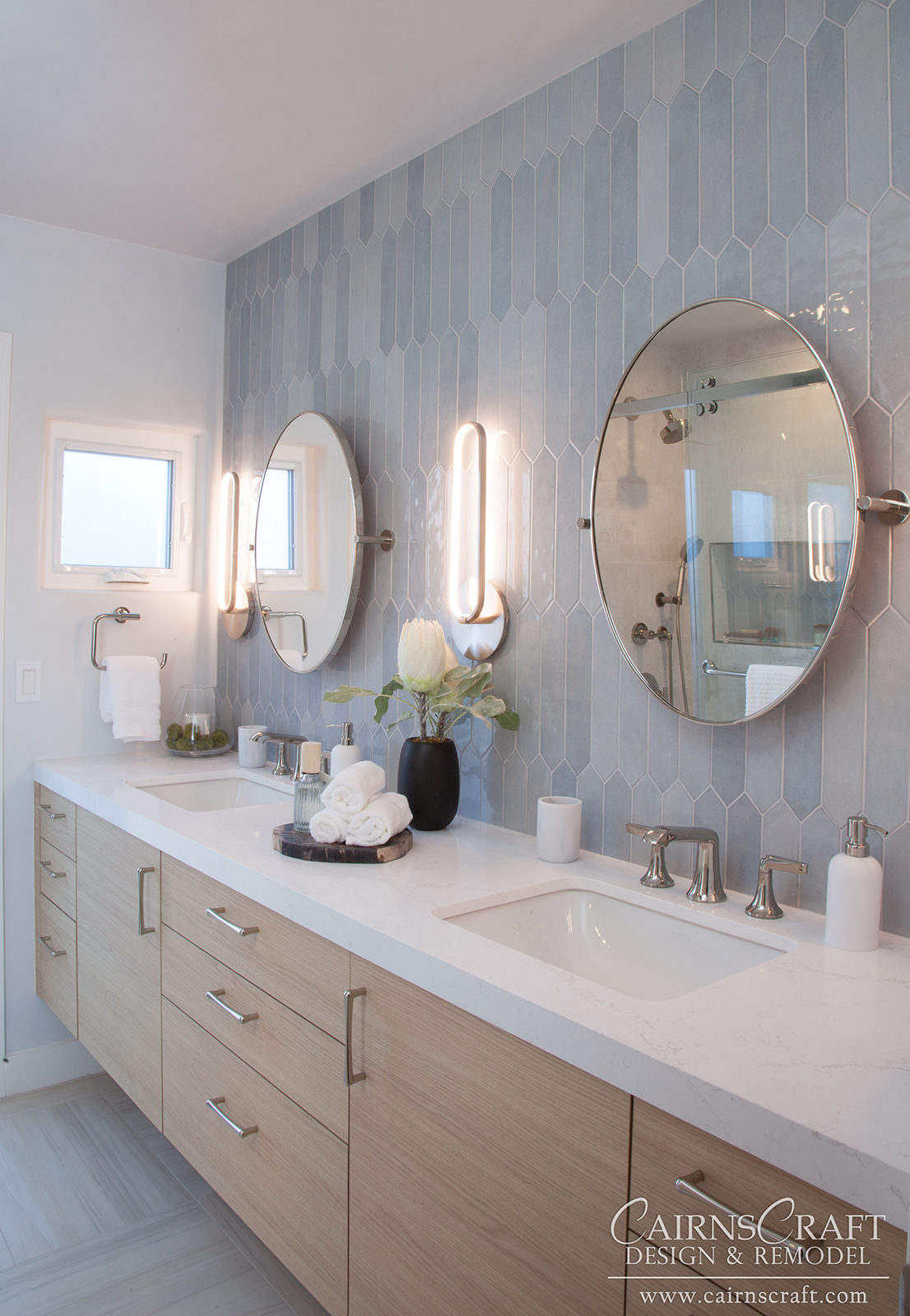 La Jolla Guest Bath with light wood cabinets and soft blue/gray tilework.