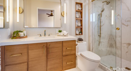 Luxe Primary Bathroom. Natural wood and glass door shower